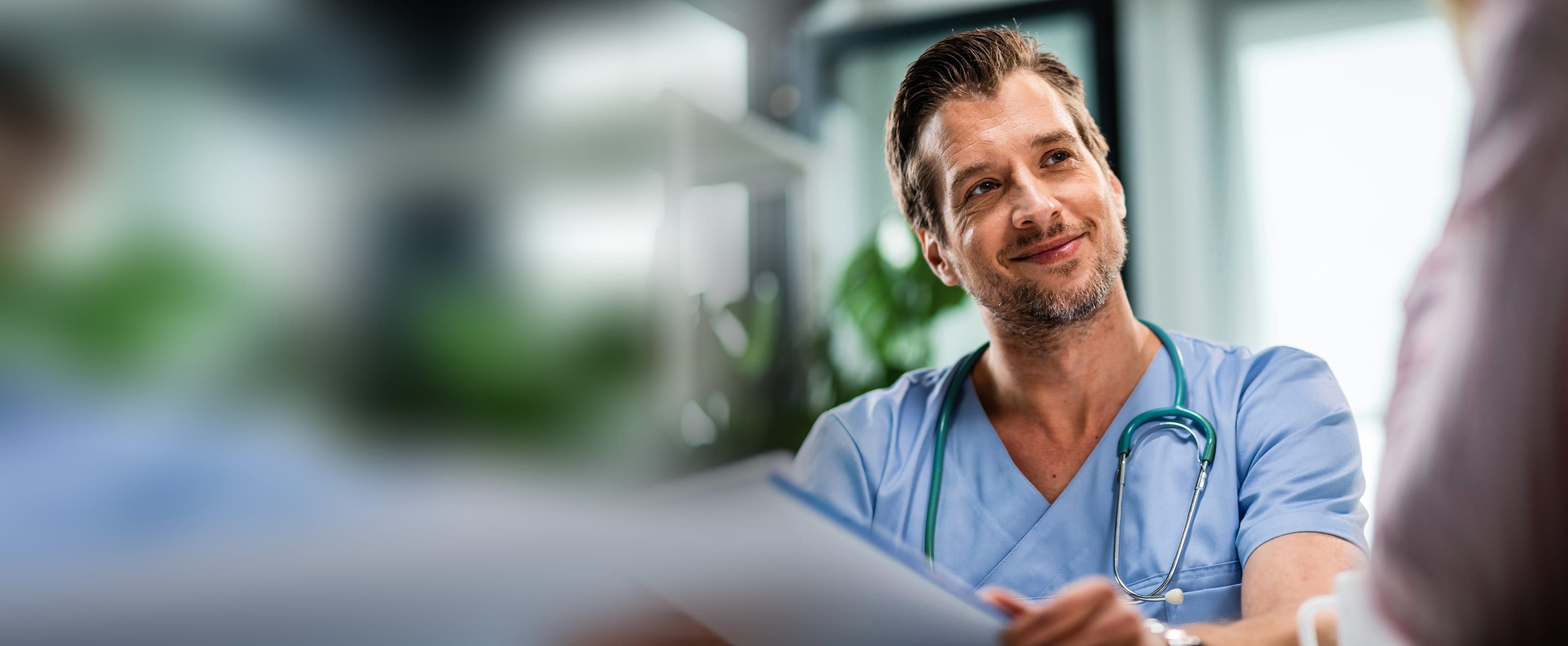 Doctor talking with a patient about her lab results in the office